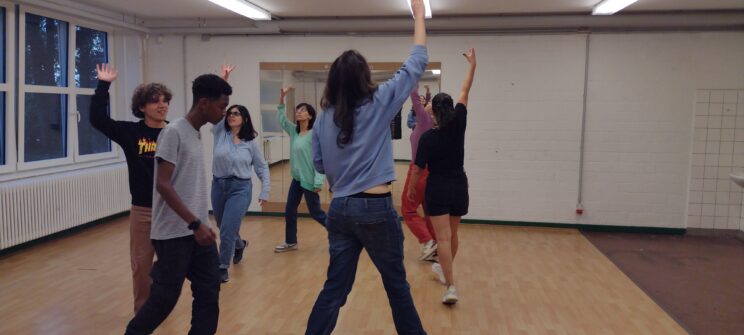 Participants doing an improv theatre activity